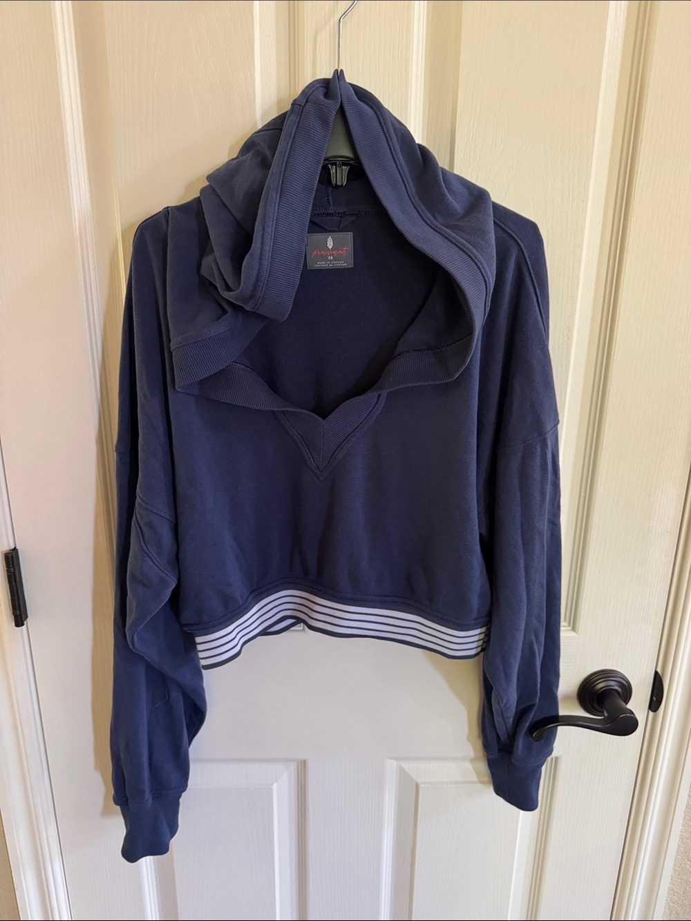 FP Movement cropped v-neck hoodie. Size XS navy blue and white. Great condition!